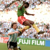 Forward Francois Omam-Biyick from Cameroon scores with a header as Argentinian defenders Nestor Lorenzo (L) and Juan Simon look on during the opening match of Italia 90  (STAFF/AFP via Getty Images)