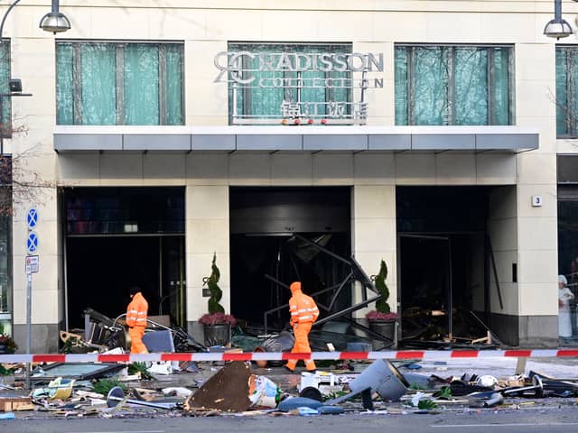 Berlin’s AquaDom aquarium containing 1,500 tropical fish bursts causing major flooding on nearby streets.