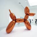 A woman accidentally destroyed a Jeff Koons glass sculpture believing it to be a balloon dog.