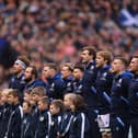 The Scotland team sing the national anthem during a Six Nations Rugby match at Murrayfield Stadium