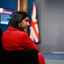 Suella Braverman listens on as prime minister Rishi Sunak announces the Illegal Migration Bill