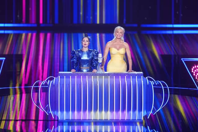 Eurovision hosts Julia Sanina and Hannah Waddingham with the Eurovision trophy