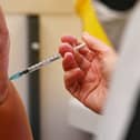 A member of the public receives a dose of the Pfizer BioNtech vaccine at a vaccination centre (Getty Images)