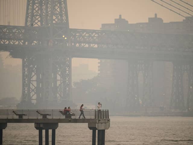 The New York city skyline and east river shrouded in smoke in Brooklyn as smoke from the hundreds of wildfires blazing in eastern Canada drifted south (Photo: Getty Images)