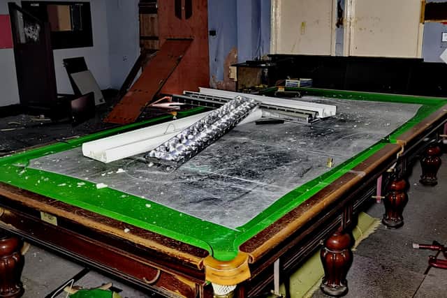 A destroyed Snooker table.