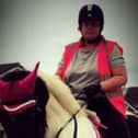 Michelle Hanney pictured riding a horse. (DWP/SWNS)