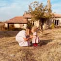 Jordan and Fae Vye outside their farmhouse in Bulgaria.