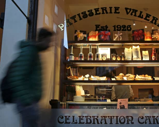 A pedestrian walks past a branch of a Patisserie Valerie cafe in London on January 23, 2019.