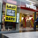  Shoppers walk past a Wilko store in Putney on September 12.