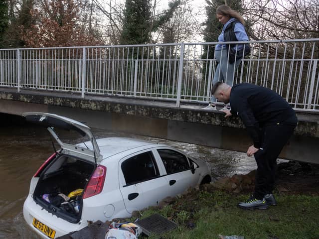 Liam Stych and Tia Draper rescuers who saved a woman and her child from a submerged car on Green Lane, in Hall Green, Birmingham. Picture: Anita Maric / SWNS