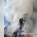 Firefighter rescues man from burning flat.