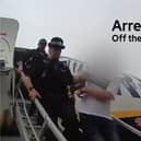 Man is arrested for disorder as he steps off plane from holiday.