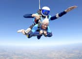 Manette Baillie, from Benhall in Suffolk, does a tandem skydive at the age of 102.