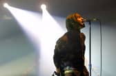 Oasis rock group performs during a concert, late 20 November 2002 in Spain. Photo: RAFA RIVAS/AFP via Getty Images