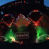 British rock group, Oasis, performing at Knebworth House, Hertfordshire, 10th August 1996. (Photo by Brian Rasic/Hulton Archive/Getty Images)