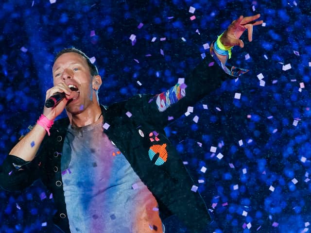 Coldplay have announced huge shows in the UK for their Music Of The Spheres tour. 