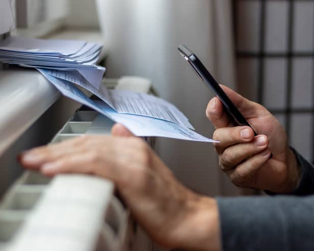Man looks at his bills.