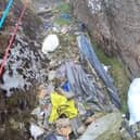 Video grab from heartbreaking footage showing 'waterfalls' of 3,000 bits of rubbish including drinks cans and Santa hats left by people on Mount Snowdon.