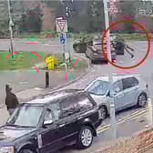 Police officer clings to car roof as suspect speeds off.