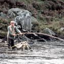 King Charles, then the Prince of Wales, enjoying fishing on the River Dee in 1982 at Balmoral, Scotland