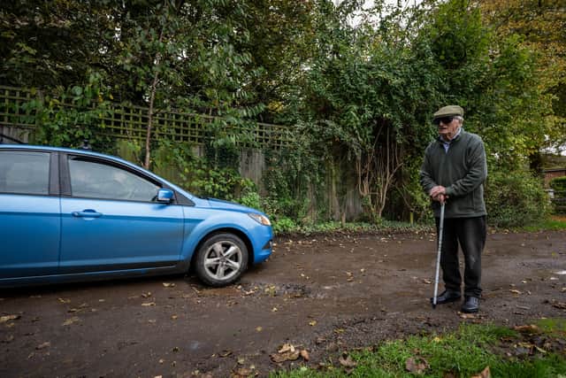 Resident Douglas Debnam on Whitebarns Lane is one of the locals locked in a bitter dispute as the lane links the main road through to village to their cul-de-sac.