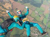 Parachuters performed mid-air manoeuvres which saw the bright turquoise liquid shaken and stirred from heights up to 10,000ft