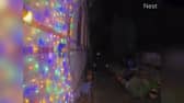 Video grab of a man snipping the Christmas lights at a property in Suffolk. 