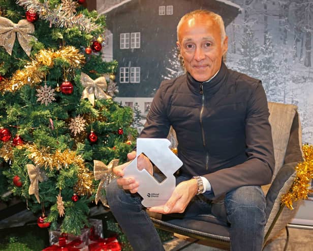 Andrew Ridgeley celebrates Wham! earning the 2024 Christmas Number 1 single for a second year in a row after the announcement on BBC Radio 1 moments ago.