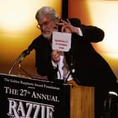 Presenter John Wilson announces the winner for  "Worst Picture",  "Basic Instinct 2" announced as "Basically it Stinks Too" during the Razzie Awards in Hollywood, CA, 24 February 2007.