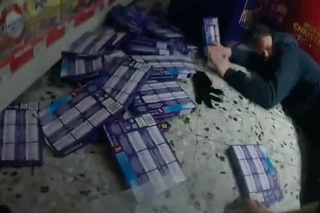 Damian Smith lies on the ground as Callum Knox grapples with an officer during supermarket robbery in  Sevenoaks, Kent, November 22 2024.