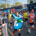 Man runs marathon dressed in Domino's Pizza box