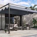 The pergola has a full-length retractable canopy to keep the sun off you