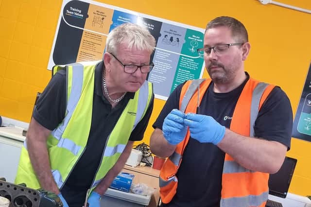 Engineers study at a training rig