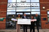 Managing Director for Persimmon Homes Midlands, David Ablett, presenting the cheque to CoppaFeel!.