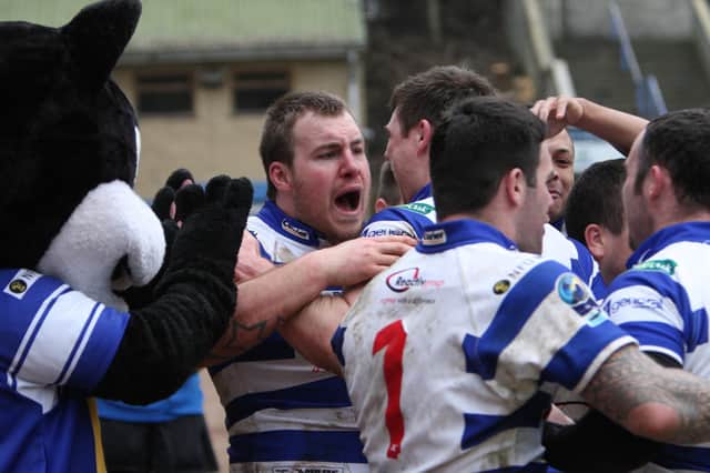Former Rovers player Sean Hesketh celebrates scoring a try for Halifax.