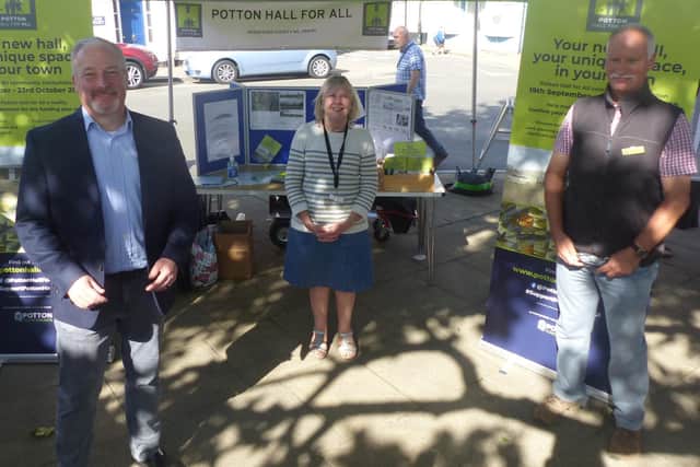 Left to right: Richard Fuller, MP stands with Potton Hall for All charity chair Liz Smith and Potton Town Council Councillor Jonathan Price-Williams, photographed at the Potton Seasonal Market on Saturday.