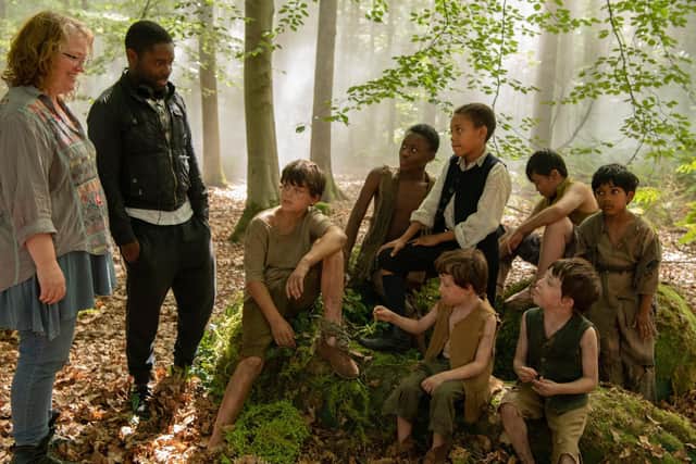 Harry and Oliver Newman (sitting together at front of photo, Oliver on the left) behind the scenes with Peter Pan and the rest of the Lost Boys, as well as David Oyelowo and director Brenda Chapman. Credit: Relativity Media