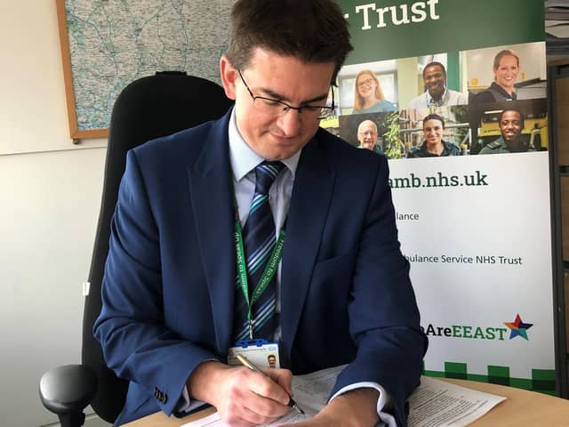 Dr Tom Davis signing the contract for the technology