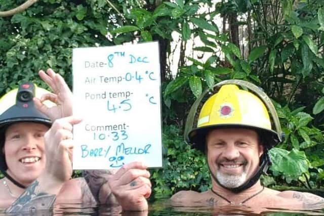 Keith and fellow firefighter Barry Mellor in the pond