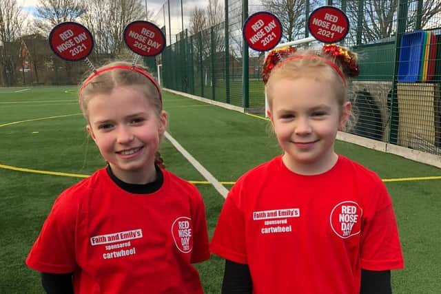 Robert Bloomfield Academy Year 5 pupils Faith, left, and Emily pictured at their sponsored cartwheel challenge, which took place at the school’s multi use games area.