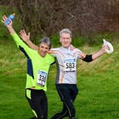 Phil (yelllow top) running in more companionable days with old school mate Jeremy Riggs: Picture by Ian Hawkes