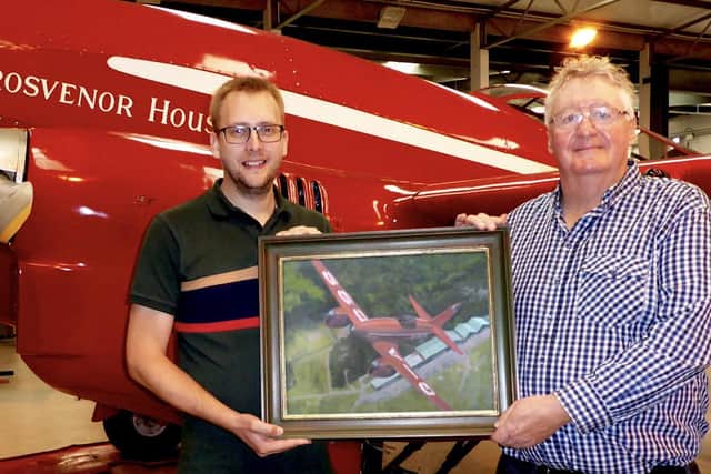 Matt receiving the DH88 Comet painting from Phil Jackson.