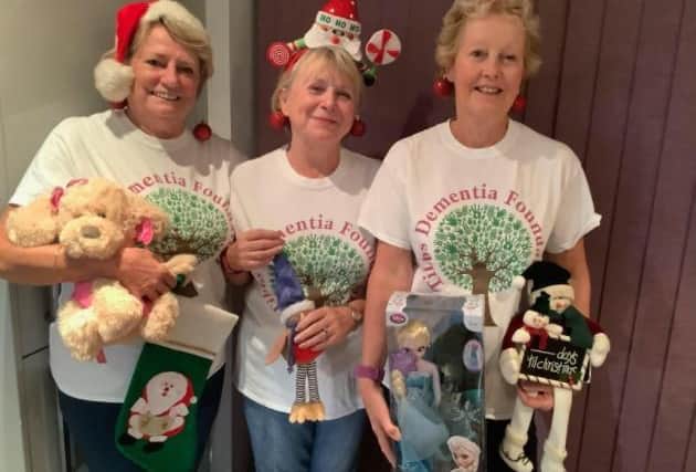 Charity Chums, with some of the Christmas prizes. Left to right: Christina, Geraldine and Judi.