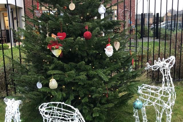 Members of the community have added decorations to the tree