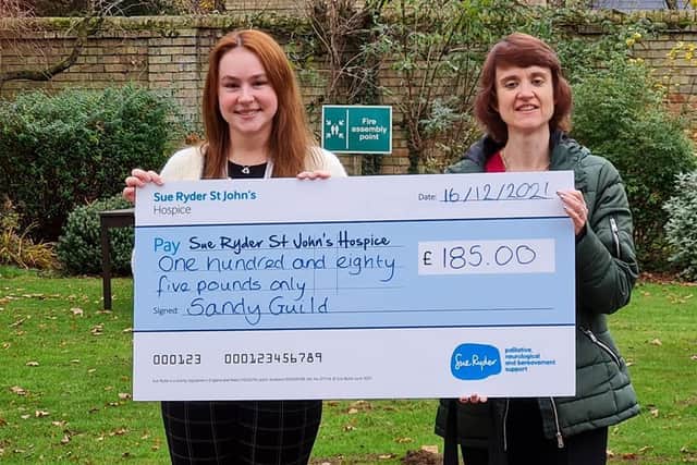 Gill Shaw (right) presenting a cheque to Sue Ryder. Photo: Sandy Guild.