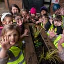 Children from Busy Bees show off their green fingers