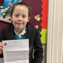 Chloe Whiteman with her letter from the council