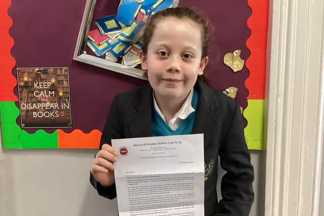 Chloe Whiteman with her letter from the council