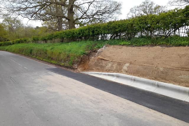 The kerb along the middle section of the Warden Road stone bank.