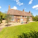This family home has an instant wow factor with its timber framed, brick facade.